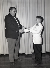 585-Travis Dorn gets certificate. May 28, 1959