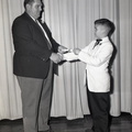 585-Travis Dorn gets certificate. May 28, 1959