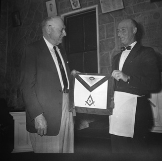 163-Dr E F Gettys presented honorary membership apron by Joe