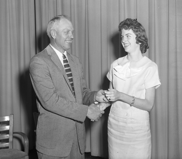 357-Carolyn Winn, Miss FHA at commencement. May 26, 1958