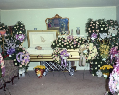 4358- Mrs Joe Holloway's body and flowers, August 25, 1972