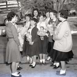 M163 Girl Scouts collect gifts for needy 20 December 1958
