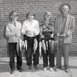 M195 Mr and Mrs Hugh McCain and Mr and Mrs M L Gilbert with fish catch 25 March 1959