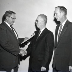 M377 Dr. C. M. Lockwood receives 30-Year Lion pin 25 October 1960