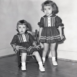 M391 Vicki and Janis McCracken puttting up Christmas tree 11 December 1960