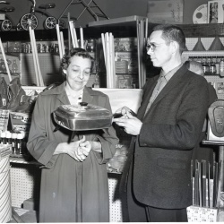 M400 White Hardware presents Mrs. Mayson with an electric frying pan 28 January 1961